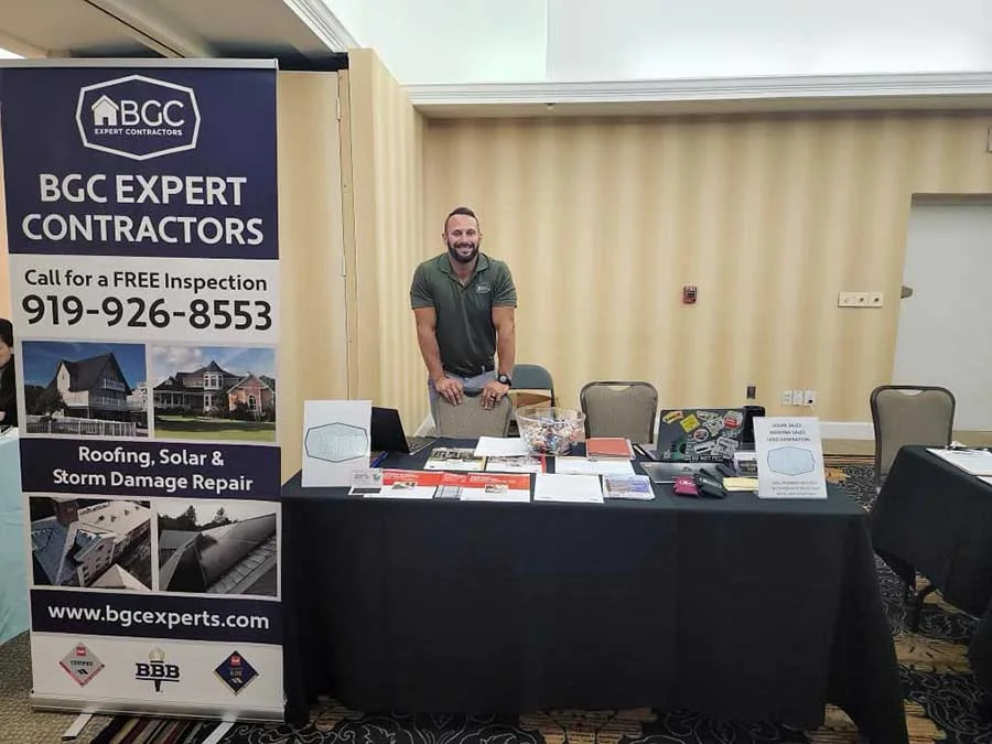 BGC Expert Contractors booth with a team member
