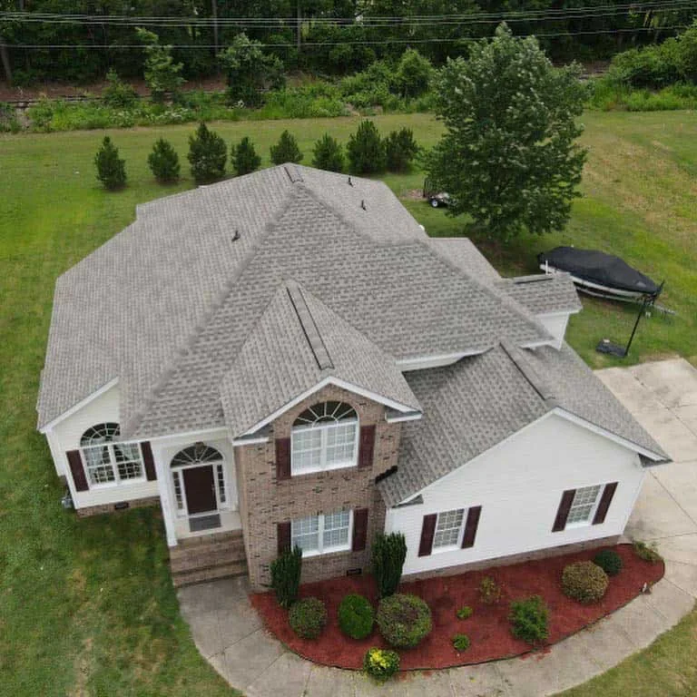 Completed shingle roof on a brick home