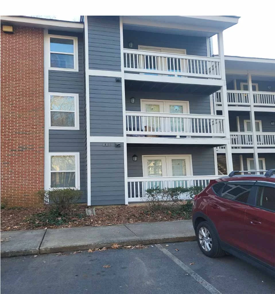 New blue siding and white trim on an apartment building