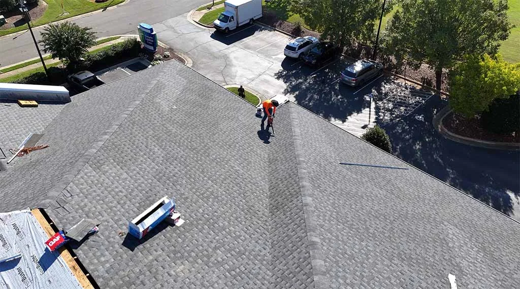 Aerial view of a BGC crew installing a new shingle roof